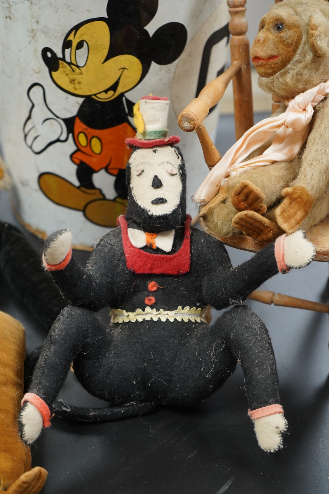 Two Nora Welling monkey soft toys, largest 38cm long and another felt made monkey together with a miniature Windsor chair and Disney Micky Mouse metal waste bin
